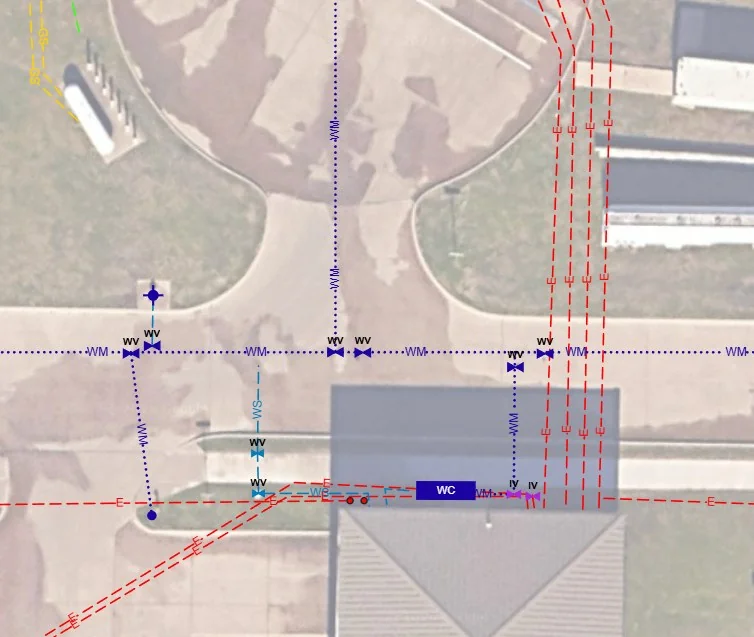 A real DPS360 Pro drawing on the Geo Map: water mains, valves and electric lines marked over an aerial photo of a commercial site